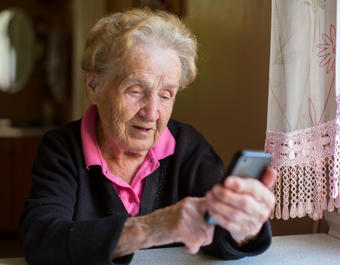 Elderly woman on smartphone  - stock