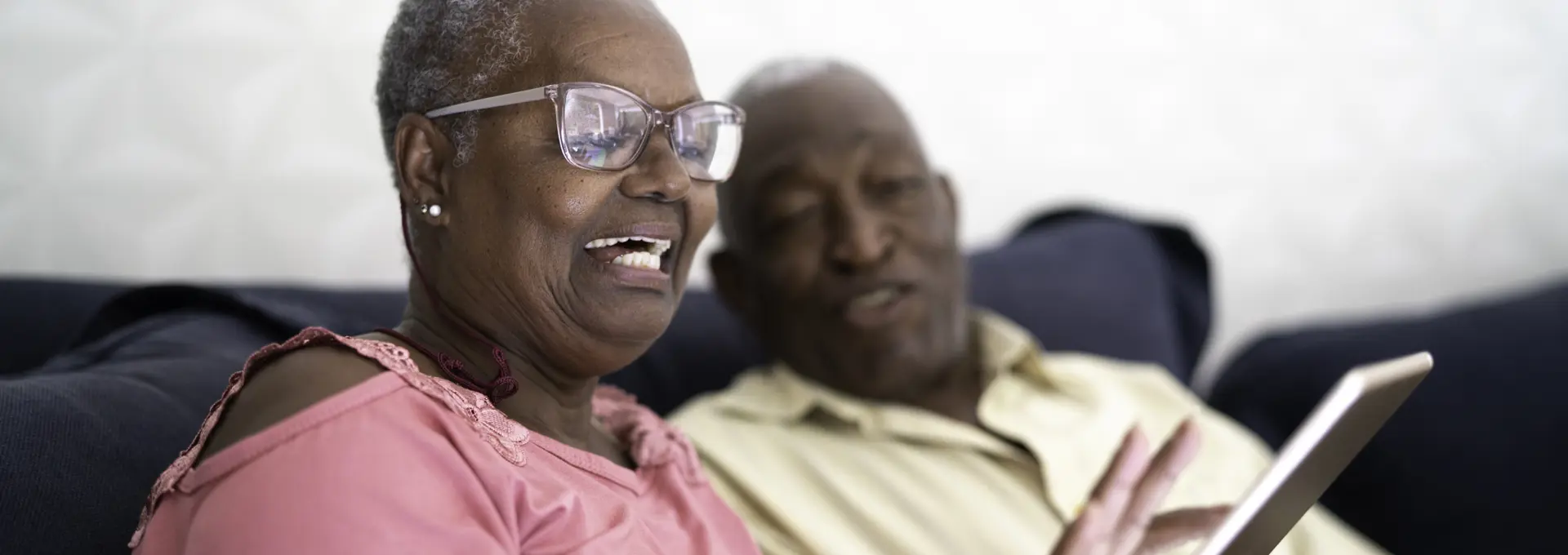 Older black couple using ipad - stock