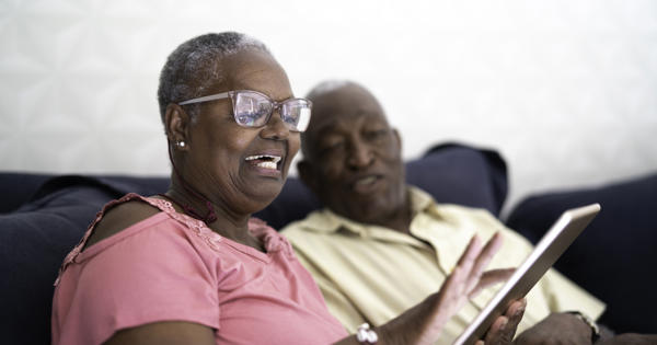 Older black couple using ipad - stock