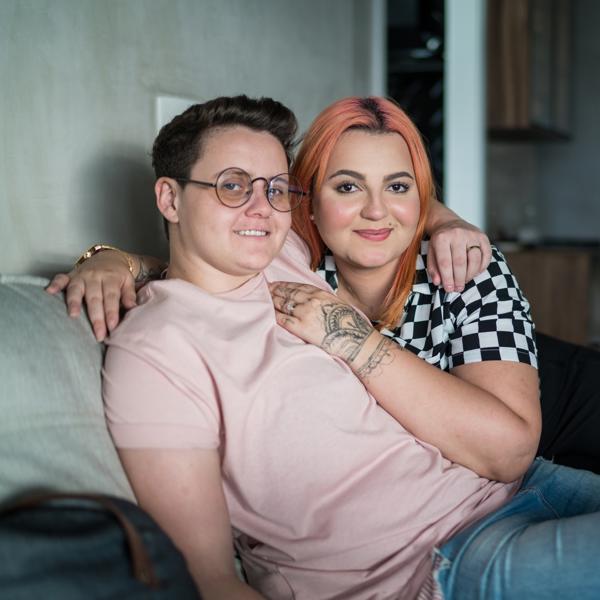 Young lesbian couple on the sofa