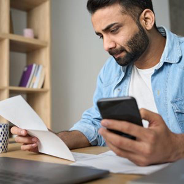 Indian Man Checking Details - stock