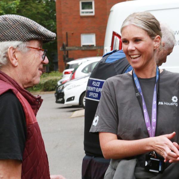 Steph Hayes speaking with resident